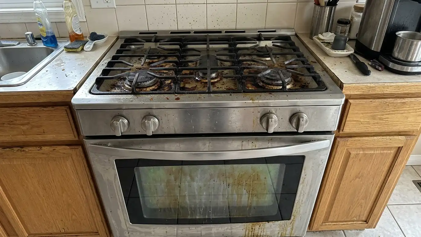 Before: a kitchen range with a gas range with burnt-on grease, stained grates and a dirty oven window
